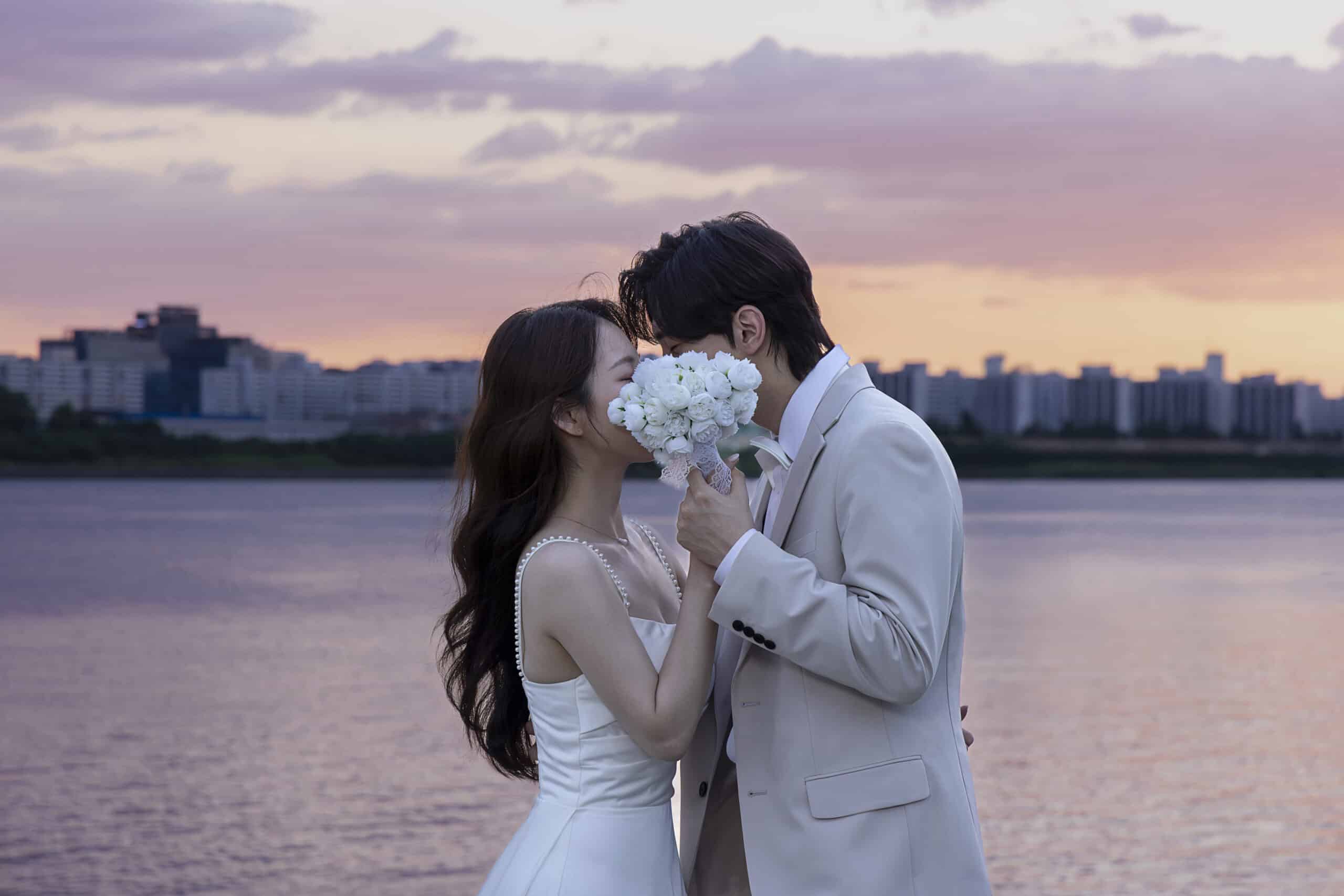 a man and woman kissing each other